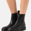 Calvin Klein Cleat Boot - Bottines - Black/Brown Mono -Next Soldes 7435d5953bc64ebb98cc21c778b034dc